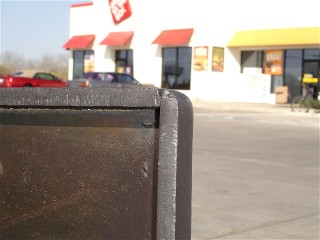 lid photo of a 1/2 hinch firebox from a portable bbq smoker